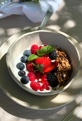 Organic yoghurt with dried fruit, strawberries, blueberries, blackberries and raspberries