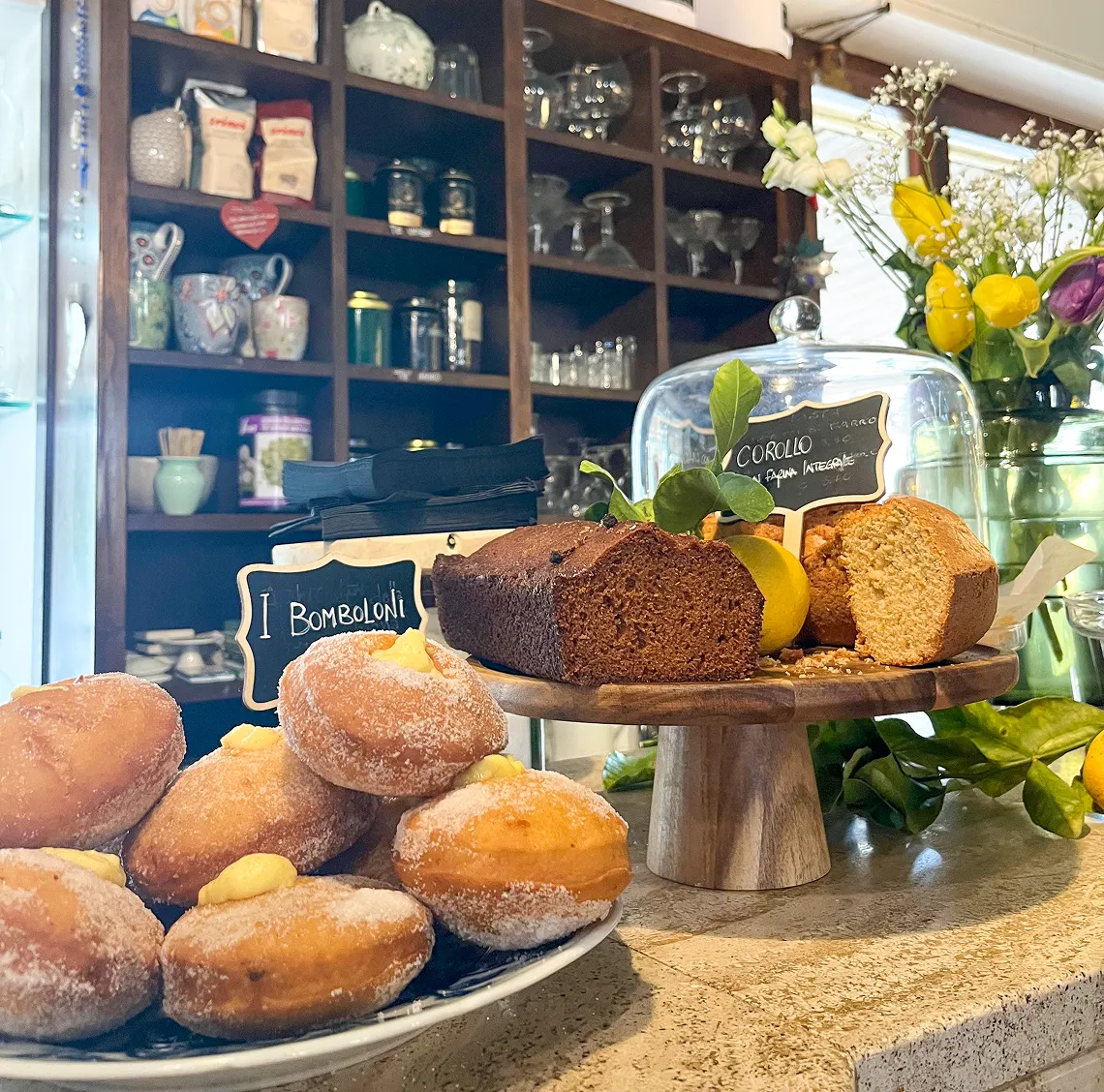 Cream-filled doughnuts, plum cakes, and donuts made fresh every morning in the kitchen at da Alcide in Venturina